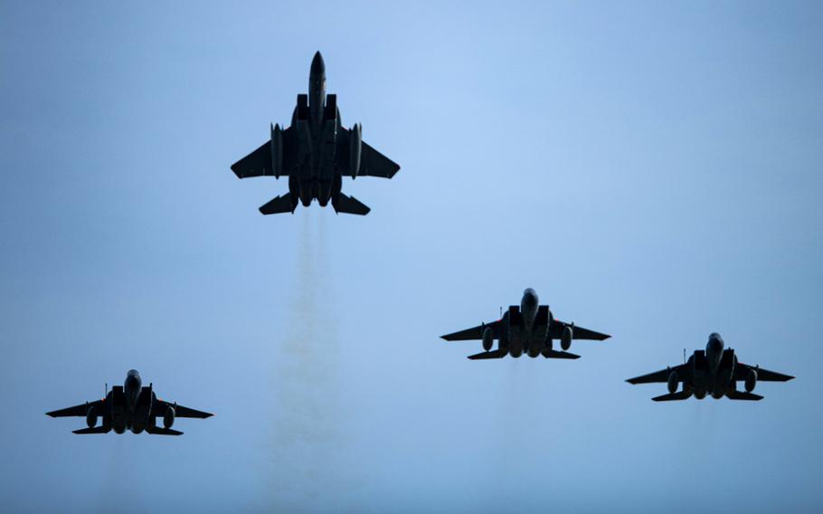 U.S. Air Force F-15C Eagles assigned to the 493rd Fighter Squadron fly a missing man formation over RAF Lakenheath, England, June 15, 2021, to mark the one-year anniversary of the death of 1st Lt. Kenneth "Kage" Allen, who was killed when his F-15C crashed into the North Sea. 