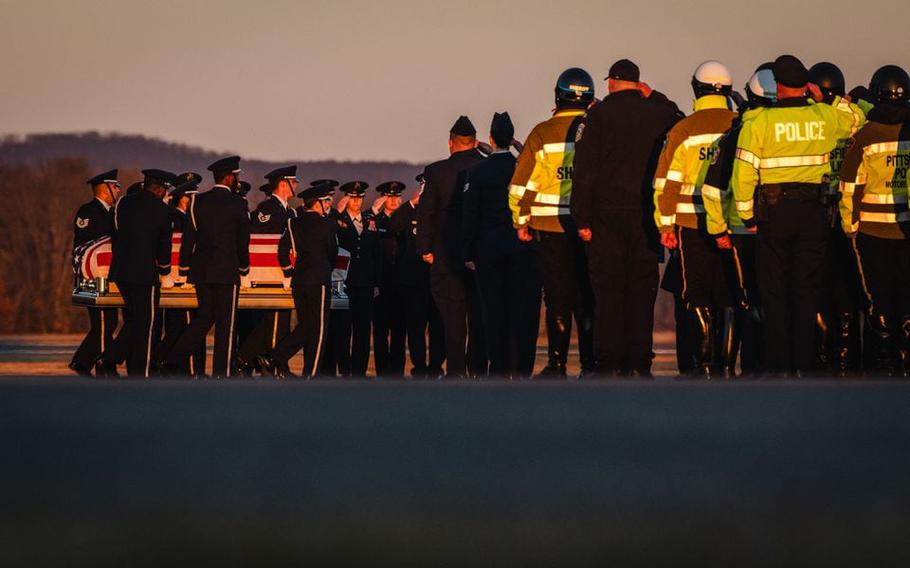 Members of law enforcement agencies pay respect to U.S. Air Force and Pittsfield, Mass., native, Air Force Staff Sgt. Jacob Galliher, killed in a training accident in Japan, at Westover Air Reserve Base, Friday, Dec. 15, 2023.