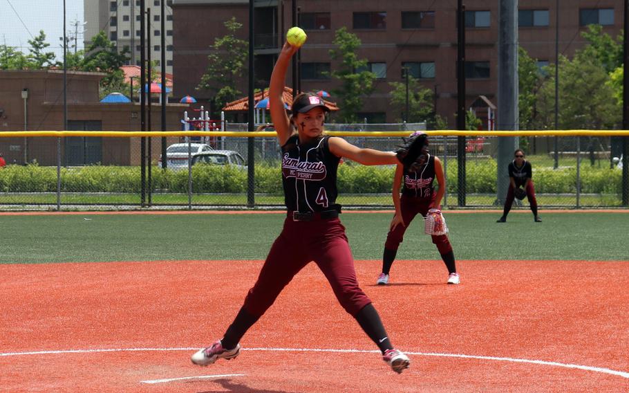 Perry right-hander Gabby Martens kicks and deliivers against Yokota.