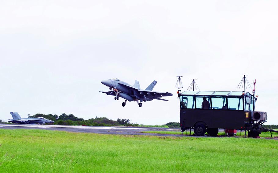 F/A-18s from Carrier Air Wing 5 at Marine Corps Air Station Iwakuni, Japan, practice arrested landings at Iwo Jima, Japan, May 17, 2019.