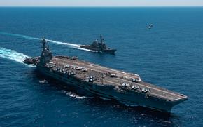 An F/A-18F Super Hornet, attached to the "Blacklions" of Strike Fighter Squadron (VFA) 213 and a F/A-18E Super Hornet, attached to the "Golden Warriors" of Strike Fighter Squadron (VFA) 87 fly over the world's largest aircraft carrier, USS Gerald R. Ford (CVN 78), the Arleigh Burke-class guided-missile destroyer USS Mahan (DDG 72), April 11, 2025. The Gerald R. Ford Carrier Strike Group is underway in the Atlantic Ocean completing integrated naval warfighting training. Composite Training Unit Exercise (COMPTUEX) is the Joint Force’s most complex integrated training event and prepares naval task forces for sustained high-end Joint and combined combat. Integrated naval training provides America’s civilian leaders and commanders highly-capable forces that deter adversaries, underpin American security and economic prosperity, and reassure Allies and partners. (U.S. Navy photo by Mass Communication Specialist 2nd Class Maxwell Orlosky