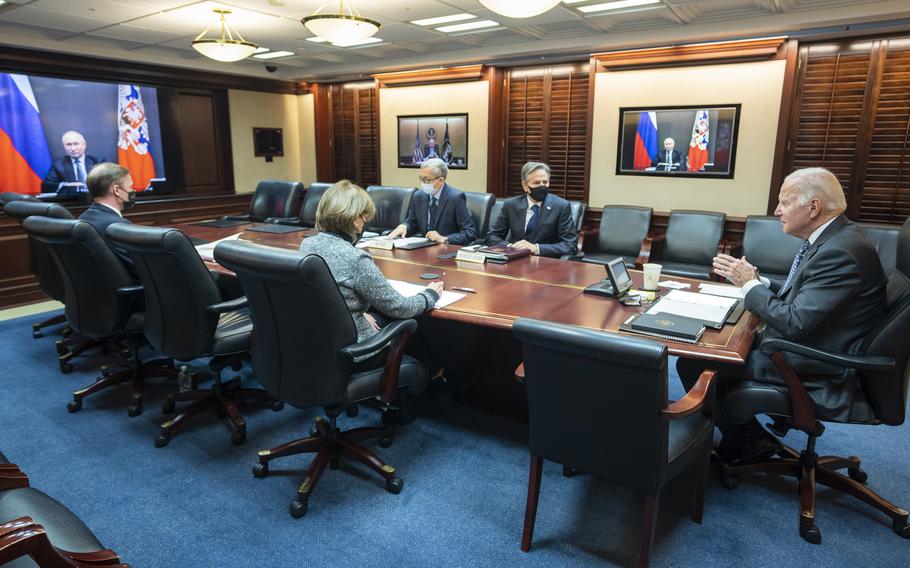 In this image provided by The White House, President Joe Biden speaks as he meets virtually via a secure video conference with Russian President Vladimir Putin from the Situation Room at the White House in Washington, Tuesday, Dec. 7, 2021. 