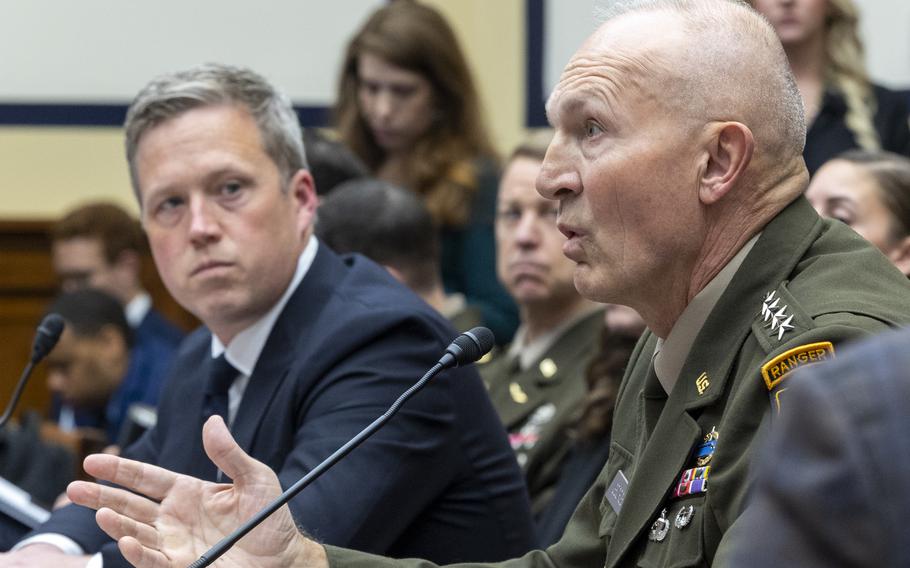 Daniel Driscoll, left, and Gen. Randy George seated. George is speaking into a microphone.