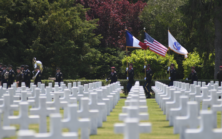 A color guard and military band walk through Oise-Aisne American Cemetery in Seringes-et-Nesles, France, on Wednesday, June 7, 2023, following the conclusion of the reinterment ceremony. 