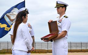 Jewel Ingram accepts the Navy and Marine Corps Medal posthumously awarded April 18, 2025, to her husband, Navy SEAL Nathan Gage Ingram, at the Silver Strand Training Complex in Imperial Beach, Calif.