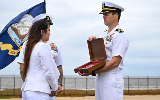 Jewel Ingram accepts the Navy and Marine Corps Medal posthumously awarded April 18, 2025, to her husband, Navy SEAL Nathan Gage Ingram, at the Silver Strand Training Complex in Imperial Beach, Calif.