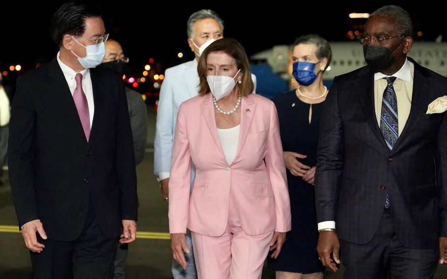 U.S. House Speaker Nancy Pelosi, D-Calif., with her delegation, arrives in Taiwan as she is welcomed by Taiwan Foreign Minister Joseph Wu, left, at Taipei Songshan International Airport, Tuesday, Aug. 2, 2022. 