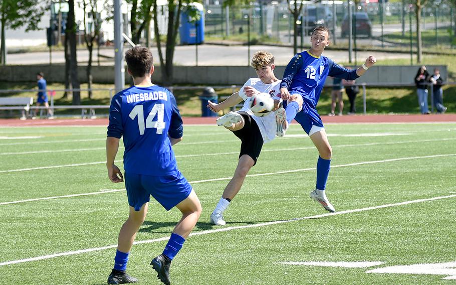 Isaac Phillipes tries to clear the ball.