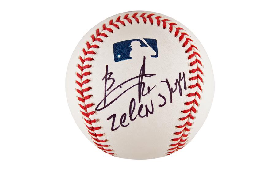 This image provided by RR Auction shows a baseball signed by Ukrainian President Volodymyr Zelenskyy. 