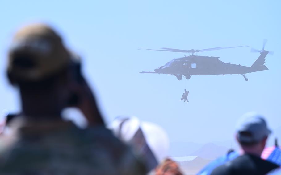 A person watches a helicopter demonstration