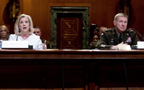 Secretary of the Army Christine Wormuth, left, accompanied by Army Chief of Staff Gen. James McConville, right, speaks during a Senate Appropriations Subcommittee on Defense budget hearing on Capitol Hill in Washington, Tuesday, May 2, 2023. (AP Photo/Andrew Harnik)