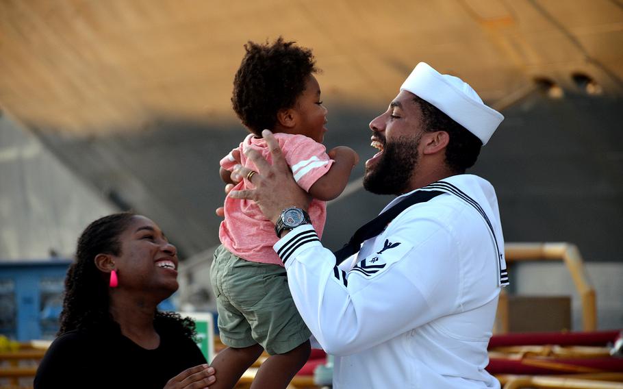 A sailor greets his family