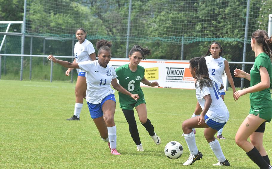 Naples' Jazmin Miranda tries to chase down Rota's Amaya Tate and the ball while the Admirals' Akira Terlaje is ready to jump in Wednesday, May 22, 2024, at the DODEA European Division II girls soccer championships at Reichenbach-Steegen, Germany.