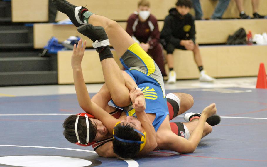Kaiserslautern’s Joseph Rodriguez, left, defeated Antonio Gutierrez in a 138-pound match at the high school 2022 Wrestling Tournament in Ramstein.