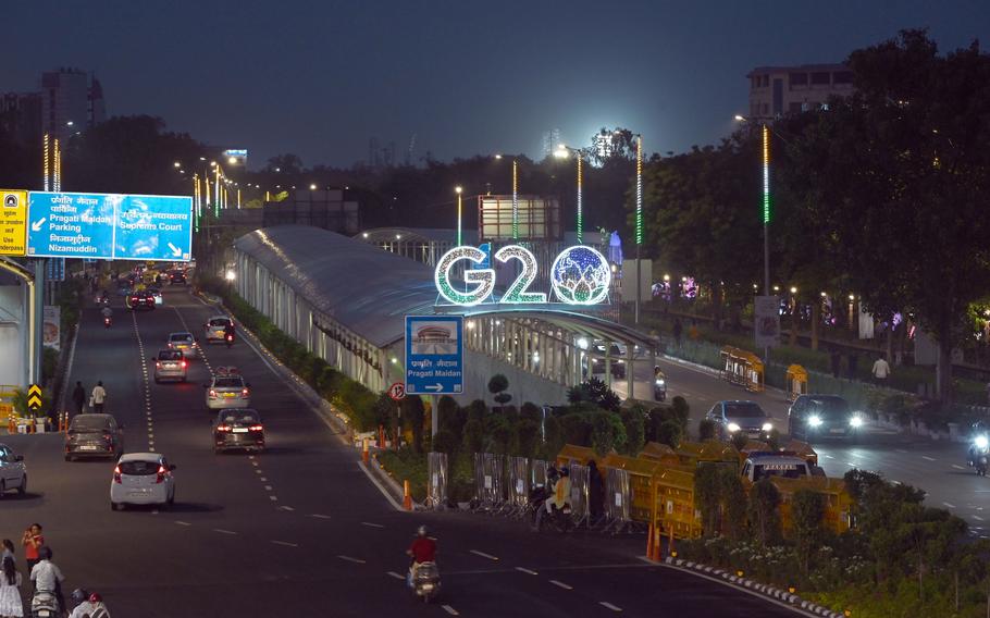Signage for the Group of 20 (G-20) summit illuminated at night outside the Bharat Mandapam, venue for the summit, in New Delhi, India, on Sunday, Sept. 3, 2023. The G-20 summit is scheduled to run through Sept. 9 to 10 in New Delhi. 