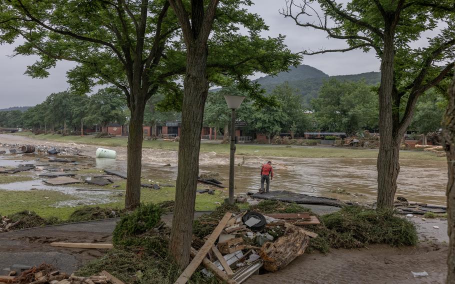 A man stands by the overflowing river Ahr in Bad Neuenahr, Germany, on July 16, 2021. 