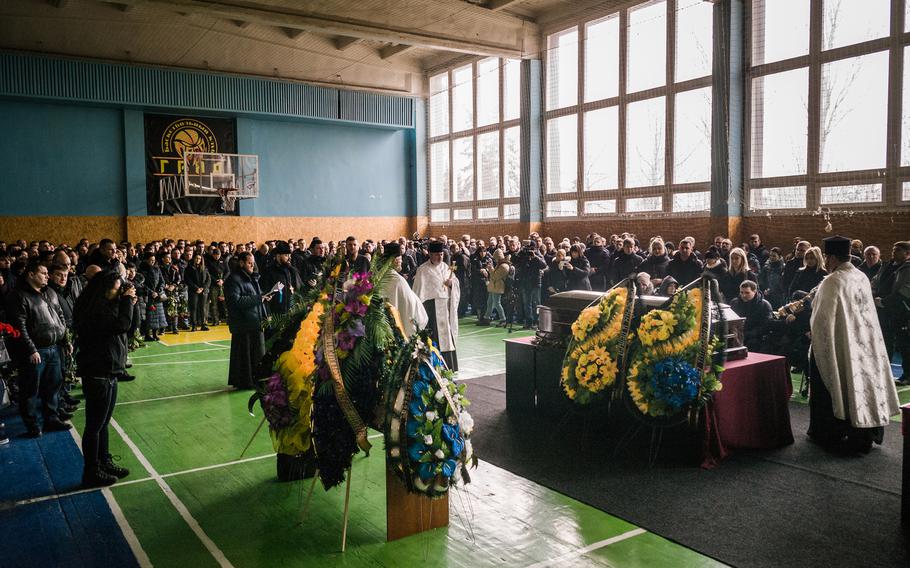 The funeral of Mykhailo Korynovskyi, 39, was held in a gym in Dnipro, Ukraine, on January 17, 2023. The boxer trainer was killed in a Russian rocket attack on an apartment building.