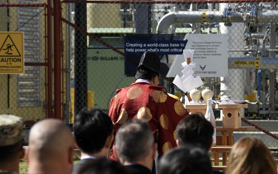 A Shinto priest from nearby Kumagawa Shrine begins the dedication ceremony for a combined heat and power plant at Yokota Air Base, Japan, on Nov. 3.