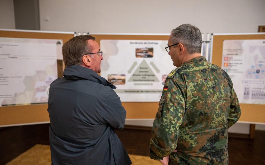 Lt. Gen. Alfons Mais, head of the German ground forces, talks with Defense Minister Boris Pistorius on May 16, 2023, at the German Infantry School in Hammelburg. Mais warned government leaders in a letter this week that plans to help reinforce NATO’s eastern flank by basing a brigade in Lithuania threaten to overextend Germany’s poorly equipped army.