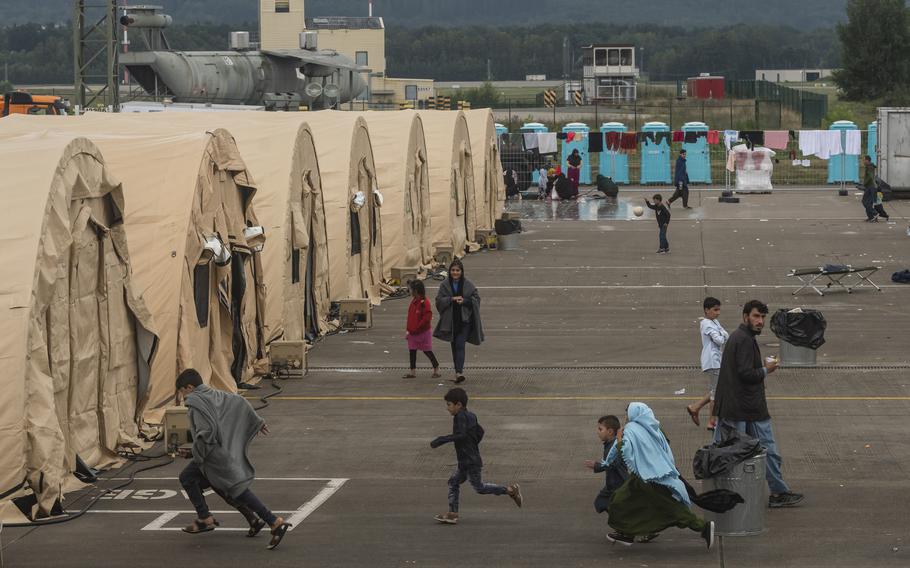 Afghan evacuees living on the flight line at Ramstein Air Base, Germany, on Monday, Aug. 30, 2021. Most of the evacuees are living in tents while they wait for flights to the United States. 