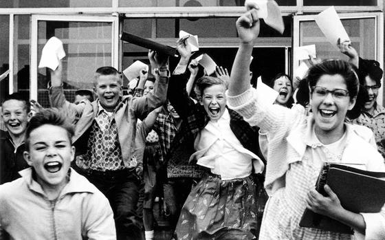 Babenhausen, Germany, 1959: The end of the last day of the school year finds lots of happy students at the elementary school in Babenhausen, the overseas home of the 36th Artillery Group.

META TAGS: last day of school; DODEA; military child; military family; 
