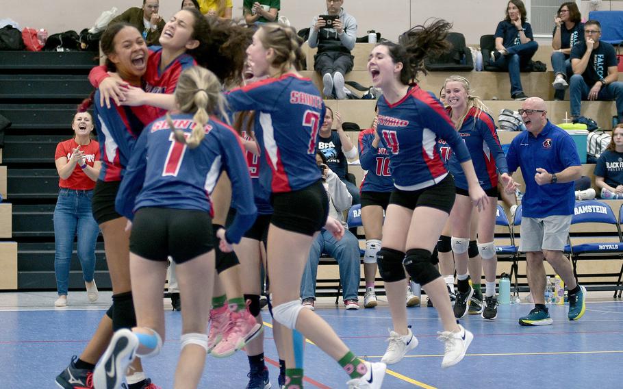 Aviano players celebrate after clinching a three-set win over the Vicenza Cougars on Thursday at Ramstein High School at Ramstein Air Base, Germany.

Matt Wagner/Stars and Stripes