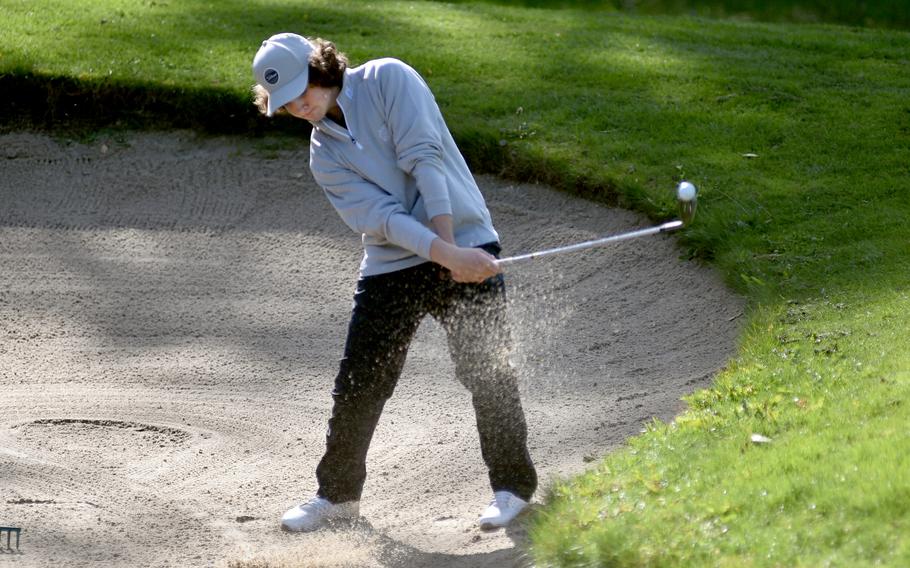 Stuttgart’s Mark Heinz chips out of the bunker on the No. 11 hole Thursday during the DODEA European golf championships at the Rheinblick Golf Course in Wiesbaden, Germany. The Panther sophomore repeated as the individual champion.