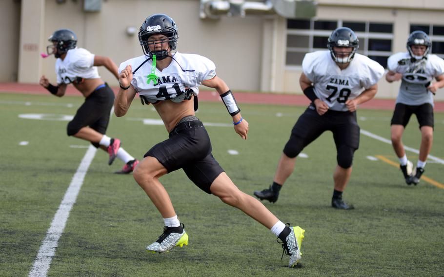 Jin Robles and the Trojans work out.