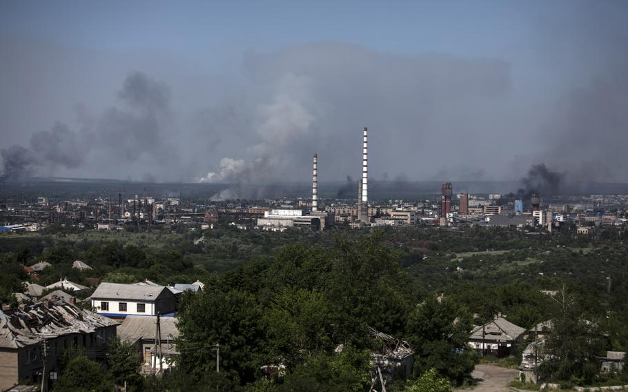 Smoke rises above Severodonetsk during a battle between Russian and Ukrainian forces on June 20. MUST CREDIT: Photo for The Washington Post by Heidi Levine.