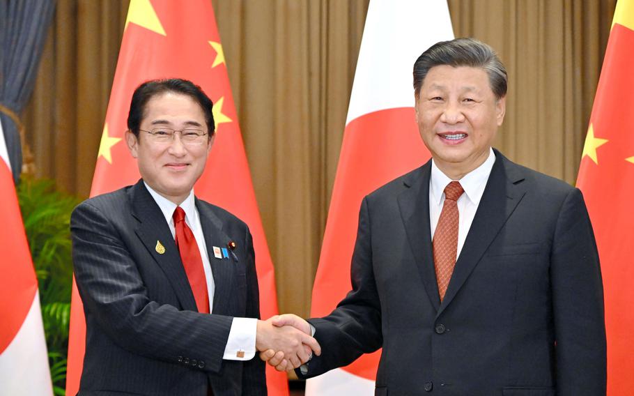 Japanese Prime Minister Fumio Kishida, left, and Chinese President Xi Jinping shake hands during their meeting on the sidelines of the Asia-Pacific Economic Cooperation, APEC, forum, Thursday, Nov. 17, 2022, in Bangkok, Thailand. Xi has used his first face to-face meetings with America’s regional allies since 2020 at the summit to make diplomatic inroads as Washington pushes back against Beijing’s influence in the Asia-Pacific.