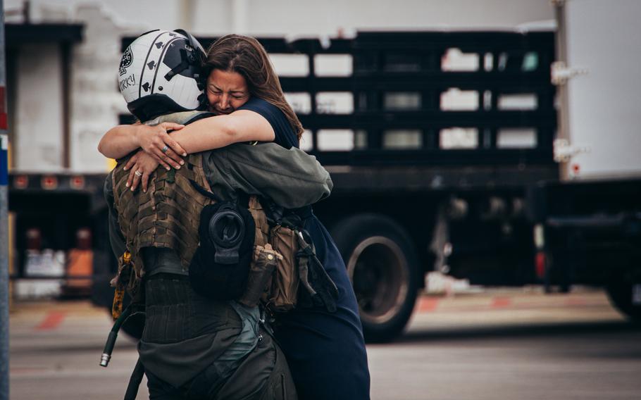 U.S. Marine AV-8B Harrier pilot Maj. Brian Neri, assigned to Marine Attack Squadron 231 Detachment, Marine Medium Tiltrotor Squadron 162 (Reinforced), 26th Marine Expeditionary Unit (Special Operations Capable) reunites with his family after returning from deployment at Marine Corps Air Station Cherry Point, N.C., Saturday, March 16, 2024.