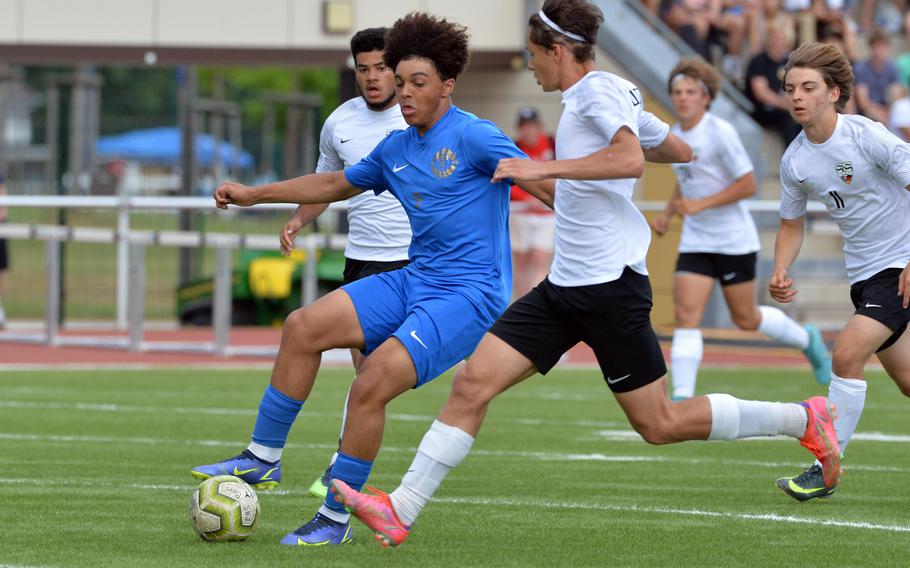 Ramstein’s Maxim Speed holds the ball as Stuttgart’s Alexander Christensen defends in the boys Division I title game at the DODEA-Europe soccer championships in Kaiserslautern, Germany, May 19, 2022.