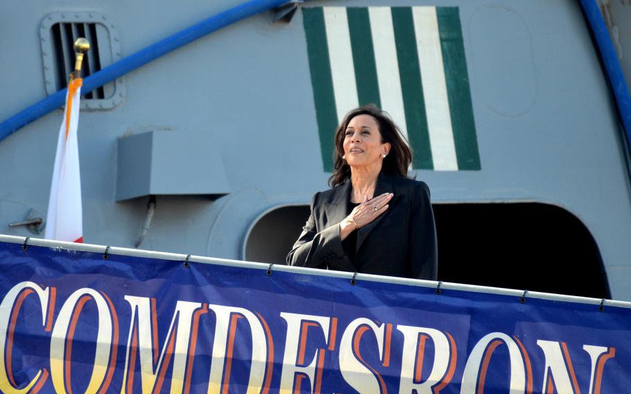 Vice President Kamala Harris salutes an American flag before boarding the guided-missile destroyer USS Howard at Yokosuka Naval Base, Japan, Wednesday, Sept. 28, 2022.  