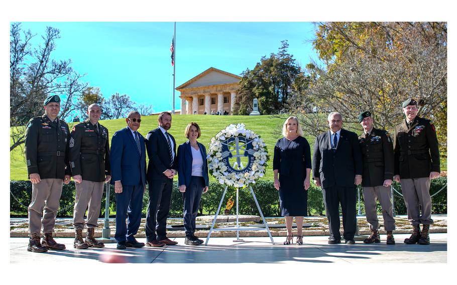 Attending a wreath-laying ceremony at Arlington National Cemetery on Wednesday, Nov. 8, 2023, are from left, Chief Warrant Officer 5 Felix Mosqueda, Command Chief Warrant Officer for 1st Special Forces Command; Command Sergeant Major David Waldo, senior enlisted leader for 1st Special Forces Command; U.S. Rep. Sanford Bishop, D-Ga.; Sen. Markwayne Mulin, R-Okla.; Kathleen Kennedy Townsend, daughter of Robert Kennedy, niece of John F. Kennedy; Secretary of the Army Christine Wormuth; Secretary of the Navy Carlos Del Toro; Big. Gen Lawrence Ferguson, Commanding General 1st Special Forces Command; Maj. Gen. Patrick Roberson, Deputy Commanding General U.S. Army Special Operations Command.