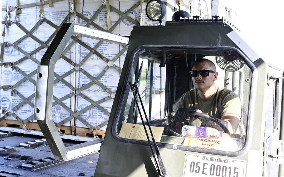 Air Force Staff Sgt. Earl Calloway unloads supplies off a U.S. Air Force C-17A Globemaster III aircraft in support of a humanitarian mission led by the United States Agency for International Development at Sukkur Airport, Pakistan, Sep. 10, 2022.