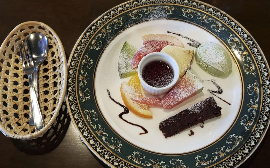 Slices of cool, fresh fruit, a wedge of chocolate cake, a dish of Japanese fruit jelly and a scoop of green tea ice cream cap off a delicious meal at Sherlock Holmes, a hamburger and steak restaurant in western Tokyo. 