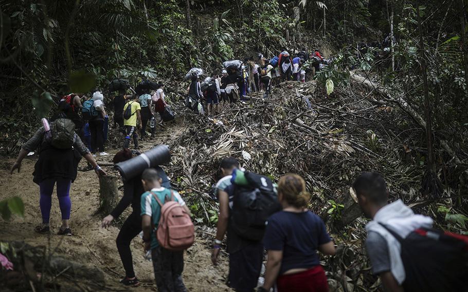 Migrants walk across the Darien Gap from Colombia to Panama in hopes of reaching the U.S., on May 9, 2023. 