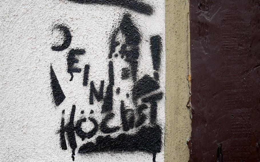 A graffito reading “your Hoechst” features the local palace tower. Hoechst is a borough of Frankfurt.