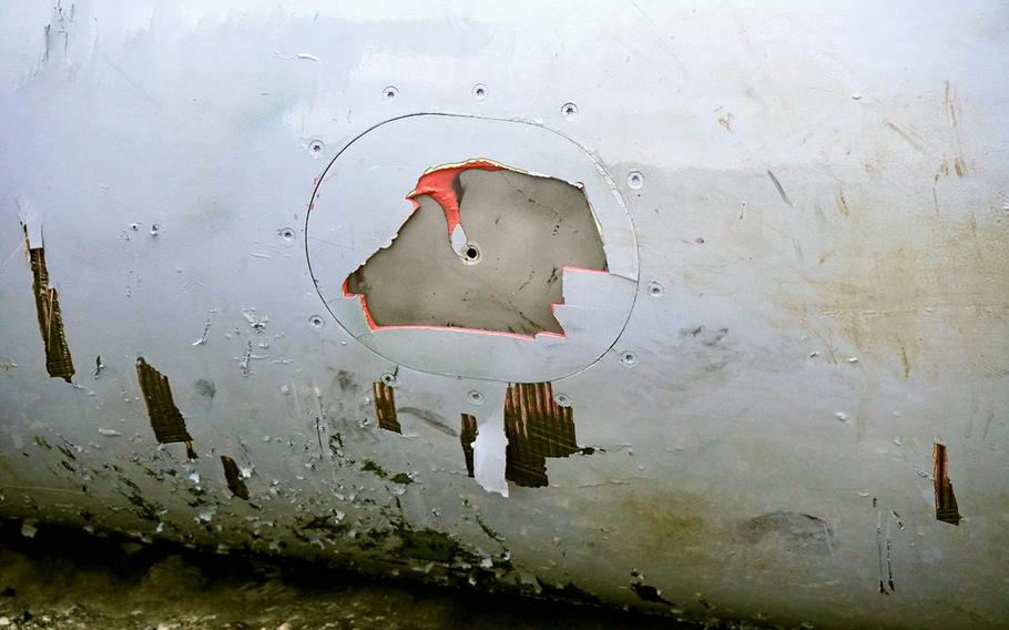 A fuel tank dropped by an F/A-18 Super Hornet assigned to the USS Ronald Reagan washed ashore in Higashi Village, Okinawa, Wednesday, June 1, 2022.