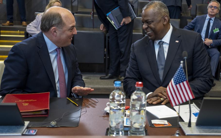Defense Secretary Lloyd Austin speaks with British Defense Minister Ben Wallace at the NATO headquarters in Brussels, Belgium, Oct. 22, 2021. NATO leaders conducted their first in-person defense ministerial meeting since the beginning of the COVID-19 pandemic.
