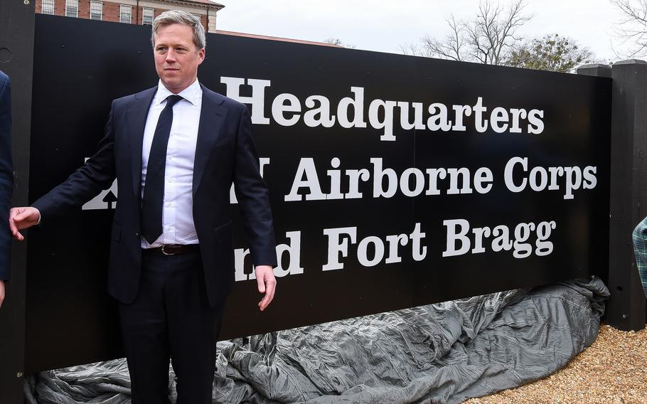 Driscoll in front of the new base sign.