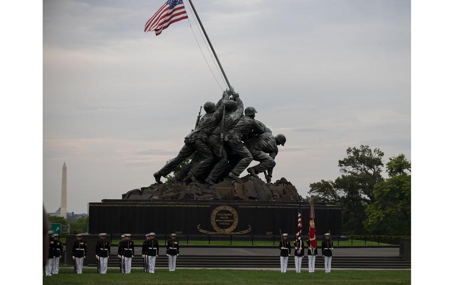 Marines with the United States Marine Corps Color Guard, Marine Barracks Washington, march onto the parade deck during a Sunset Parade at the Marine Corps War Memorial, Arlington, Va., July 23, 2024. 