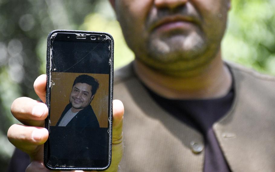 Afghan journalist Zainullah Stanikzai keeps photos on his phone of Aliyas Dayee, his friend and a fellow reporter, who was killed Nov. 12, 2020, in southern Helmand province when a bomb attached to his car detonated. Press freedom has been restricted since the Taliban took control of Afghanistan, a human rights group and Afghan journalists say.