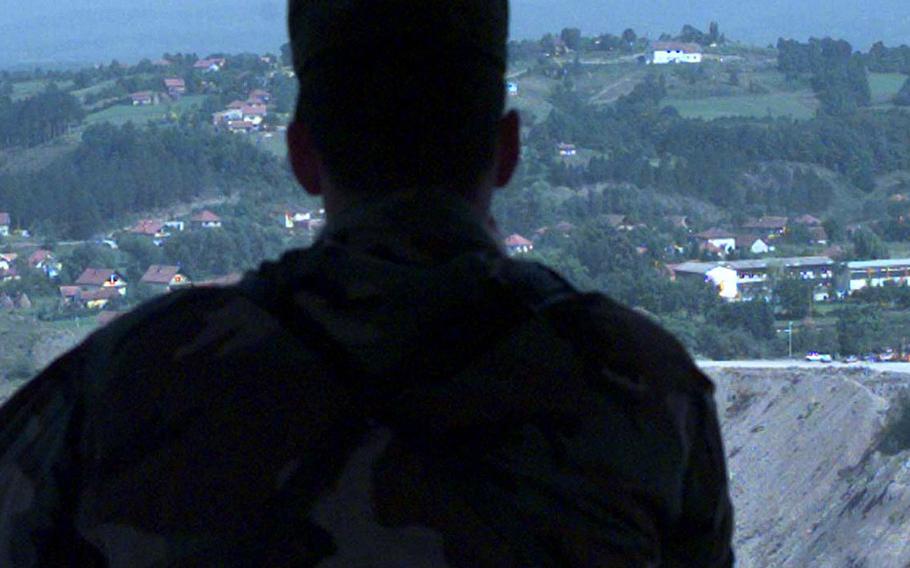 The Mayor of Camp Bedrock, Capt. David Miller looks out over the villages in the valley and the quarry which Camp Bedrock was built upon. 