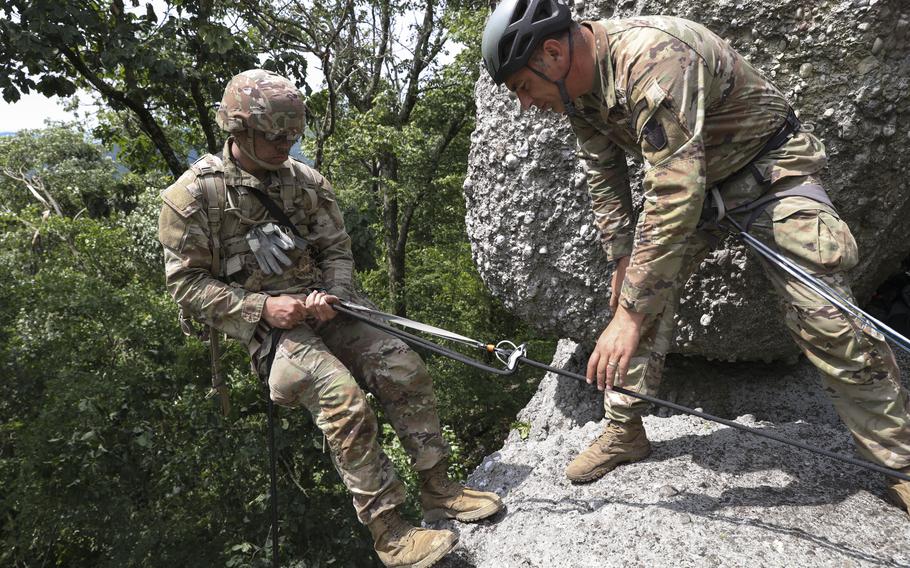 Approximately 25 soldiers with 1st Squadron, 104th Cavalry Regiment, 2nd Infantry Brigade Combat Team, 28th Infantry Division, Pennsylvania Army National Guard, conducted rappel training June 13, 2023, at a rock formation near Fort Indiantown Gap known as Boxcar Rocks. The soldiers used mountain warfare skills to ascend the north face of the Boxcar Rocks safely with harnesses and ropes, then rappelled down the south face approximately 100 feet.