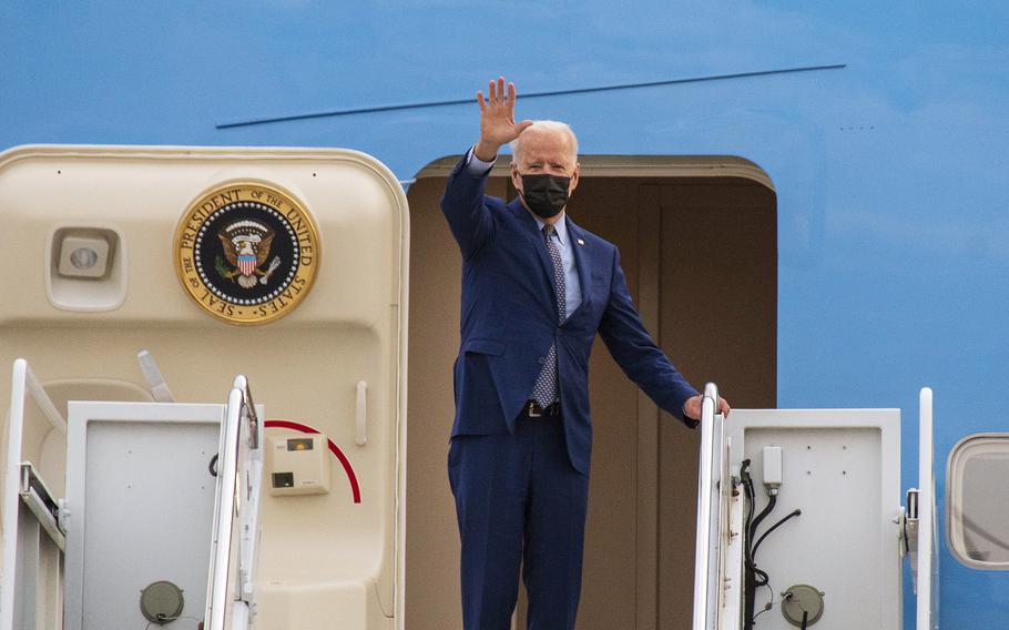 President Joe Biden waves before boarding Air Force One at Dobbins Air Reserve Base, Ga., April 29, 2021.