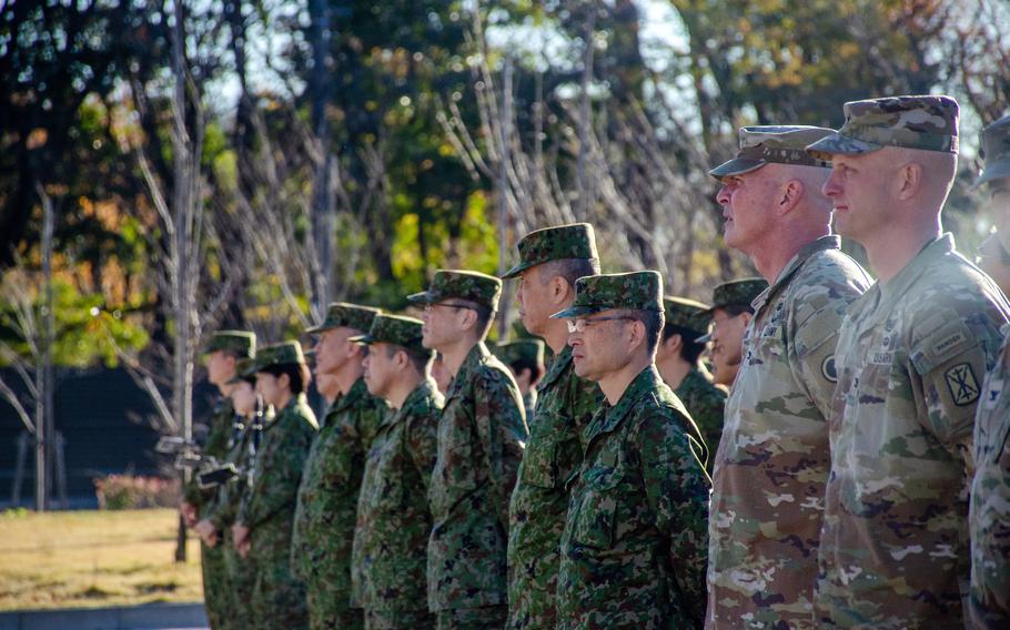 Troops from Japan, the United States and Australia attend an opening ceremony for the Yama Sakura exercise at Camp Asaka in Tokyo, Monday, Dec. 4, 2023.