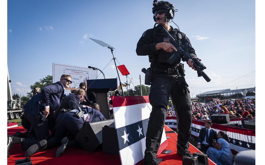 U.S. Secret Service agents and counter assault team members respond after shots were fired toward former president Donald Trump on Saturday, July 13, 2024, at a rally in Butler, Pa.