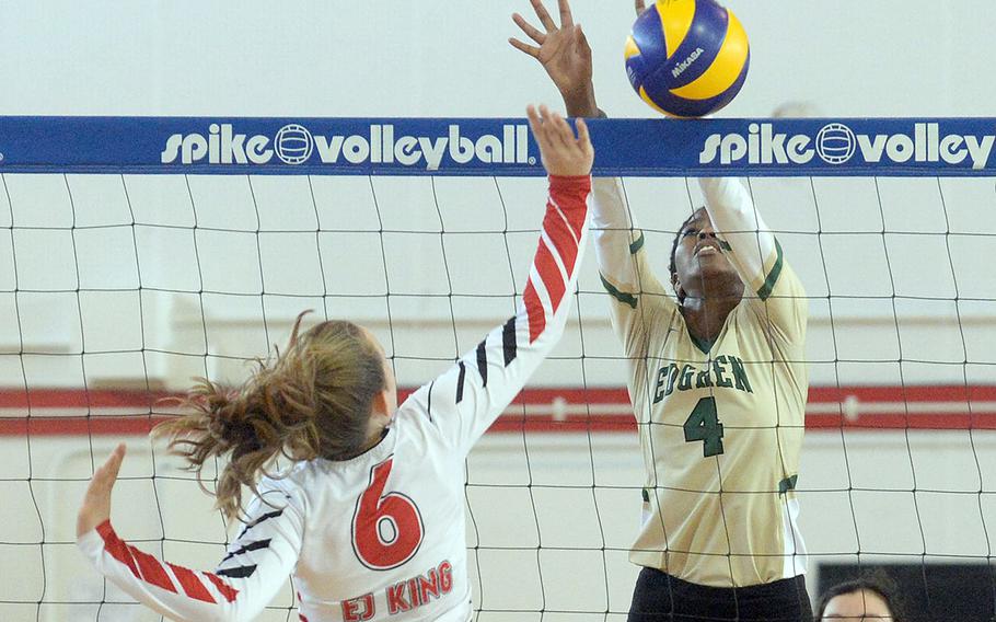 Robert D. Edgren's Elizabeth Johnson goes up to block E.J. King's Madylyn O'Neill's shot.