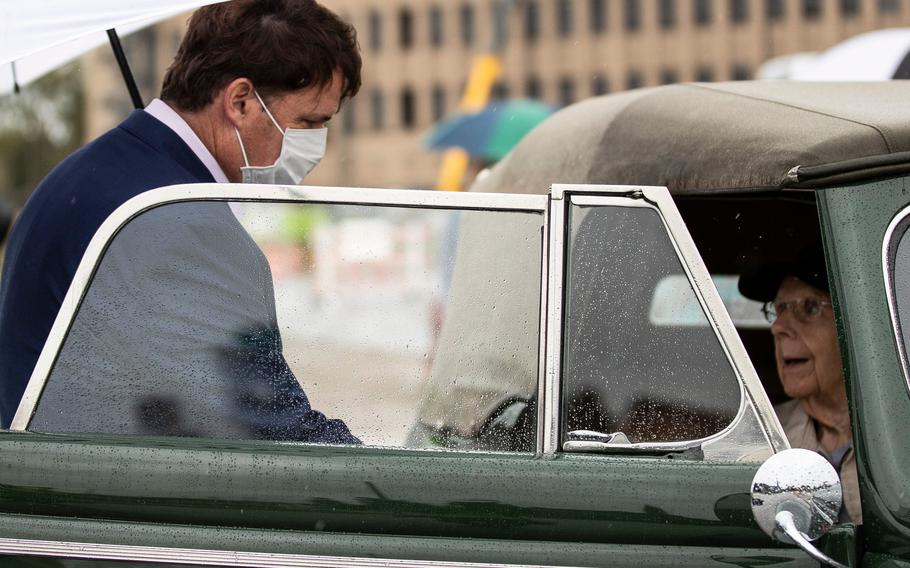 Ford CEO Jim Farley welcomes George England at Michigan Central Station in Detroit on Sept. 25, 2021.